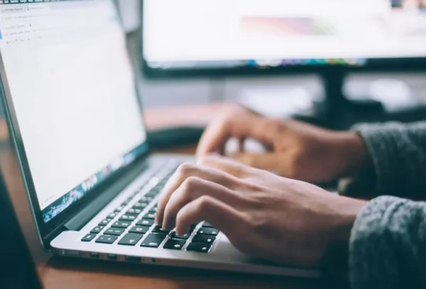 glenn-carstens-peters-npxXWgQ33ZQ-unsplash-scaled Person on laptop